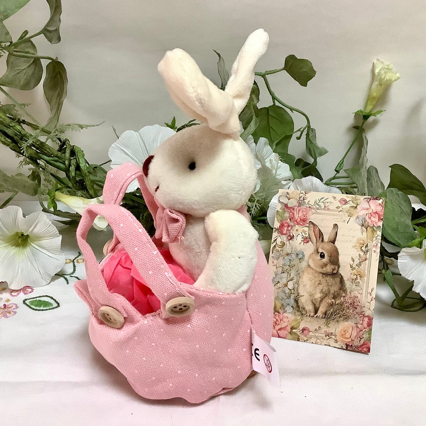 Lapin blanc peluche avec sac rose pois